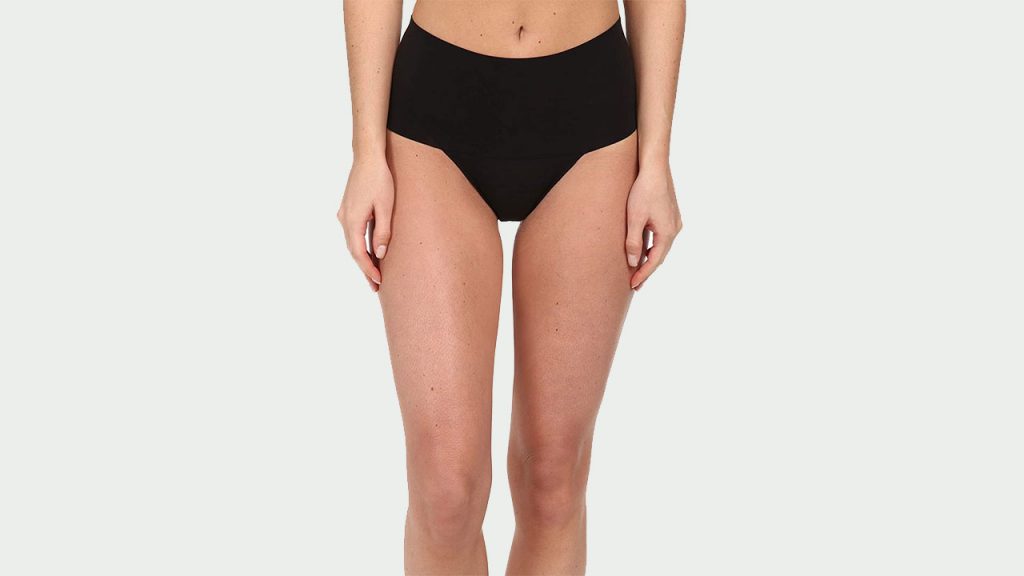 An image of a woman wearingSPANX Women's Undie-Tectable Thong